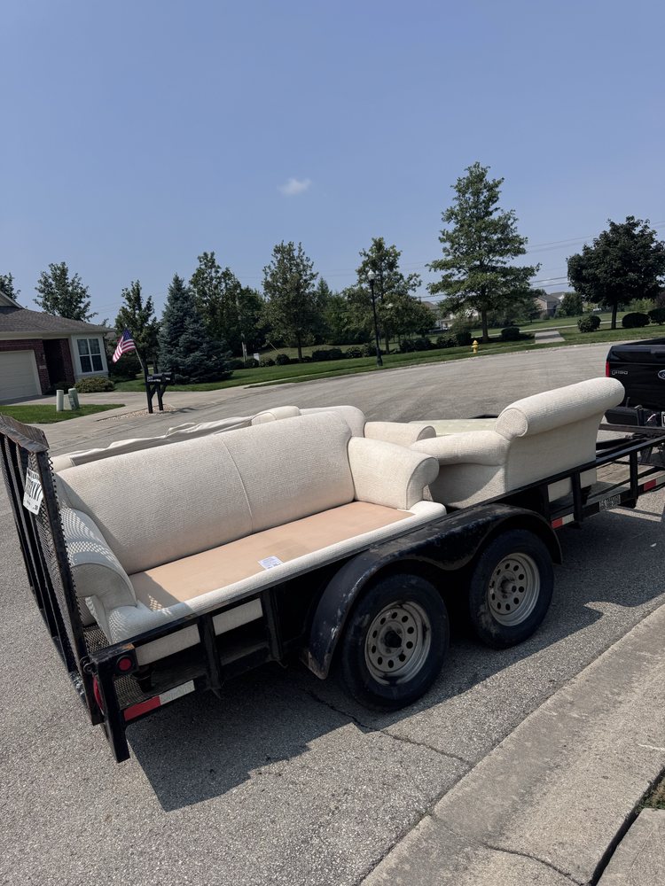 Furniture removal trailer loaded with a sofa and chair in Carmel, IN by A1 Home Services