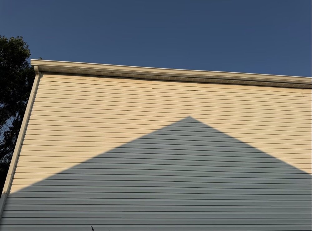 Residential gutter and siding maintenance on a Carmel, IN home