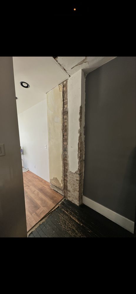 Interior handyman renovation with flooring and wall work in Carmel, IN